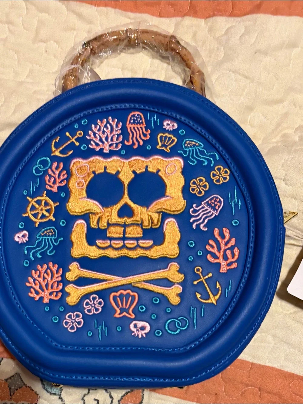 Loungefly Blue Round Crossbody Bag with Yellow SpongeBob Embroidered Skull